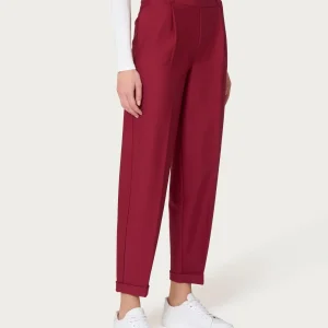 Pantalone a carota con tasche e pinces in Compact - Tibetan Red
